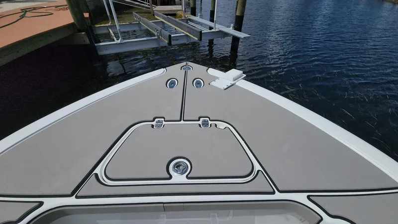 Slide: The Image of 2005 Yellowfin 31 boat bow at dock, calm water background. - 45