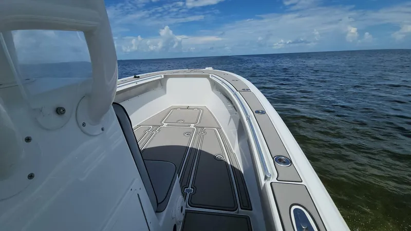 Slide: The Image of 2005 Yellowfin 31 boat on open water under blue sky. - 7