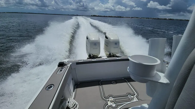 Slide: The Image of 2005 Yellowfin 31 boat cruising on open water with twin engines. - 8