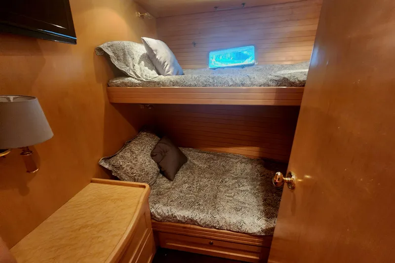 Slide: The Image of Cozy cabin with bunk beds in 1999 McKinna 57 Pilothouse yacht. - 13