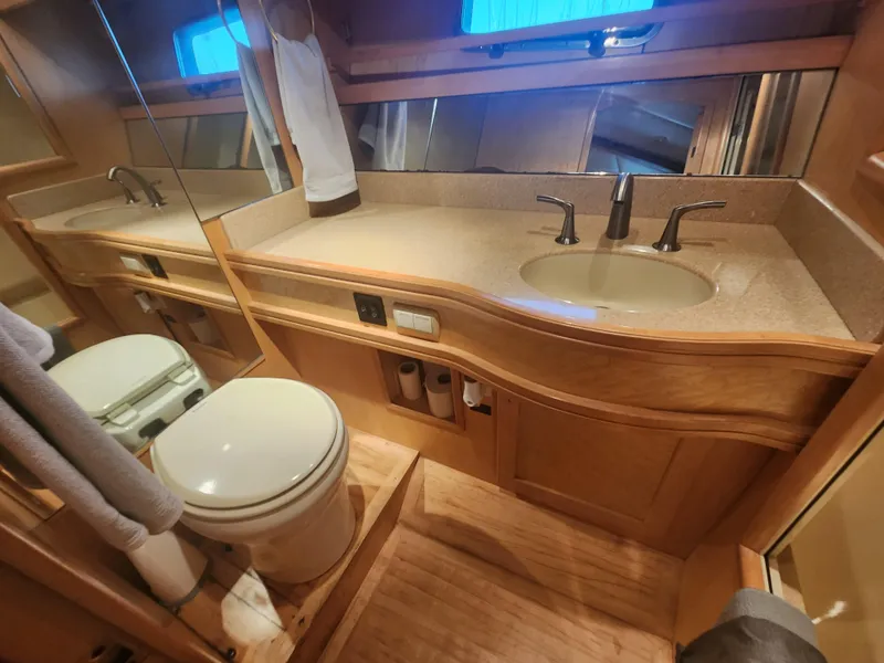 Slide: The Image of Bathroom interior of 1999 McKinna 57 Pilothouse yacht with sink and toilet. - 14
