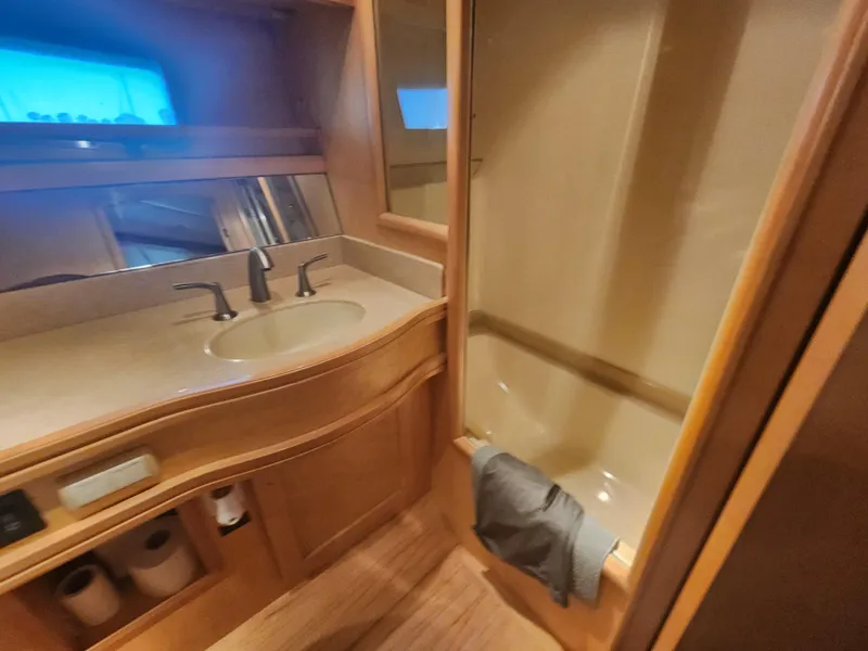 Slide: The Image of Bathroom interior of 1999 McKinna 57 Pilothouse yacht with sink and shower. - 15