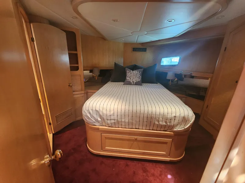Slide: The Image of Luxurious bedroom interior of 1999 McKinna 57 Pilothouse yacht with cozy bed and elegant decor. - 16