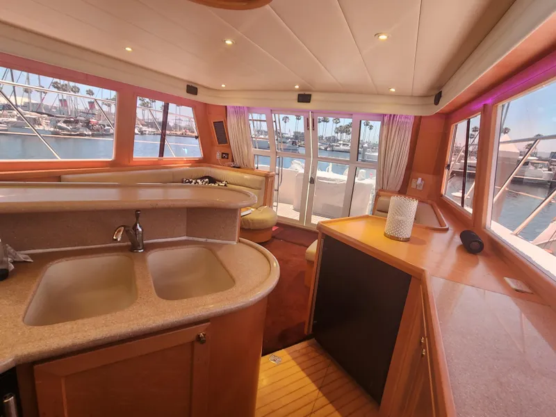 Slide: The Image of Interior of 1999 McKinna 57 Pilothouse yacht with spacious kitchen and panoramic windows. - 4