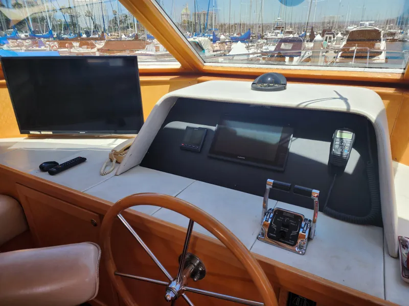 Slide: The Image of Pilothouse of 1999 McKinna 57 yacht with steering wheel, controls, and navigation equipment. - 5