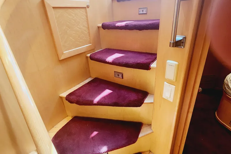 Slide: The Image of Staircase with purple carpet in 1999 McKinna 57 Pilothouse yacht interior. - 8
