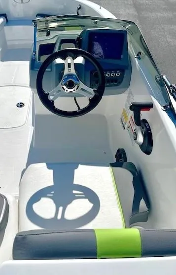 Slide: The Image of 2023 Tahoe T16 boat cockpit with steering wheel and control panel. - 4