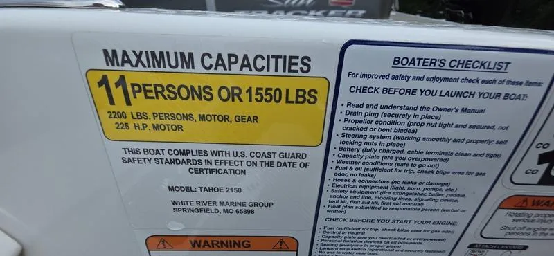 Slide: The Image of 2024 Tahoe 2150 boat capacity label, 11 persons or 1550 lbs, safety checklist included. - 12