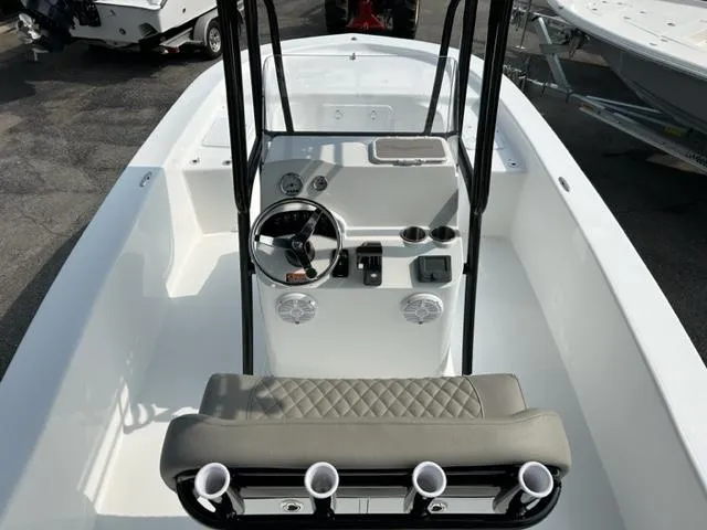 Slide: The Image of 2024 Savannah SS21 boat interior with steering console and seating. - 20
