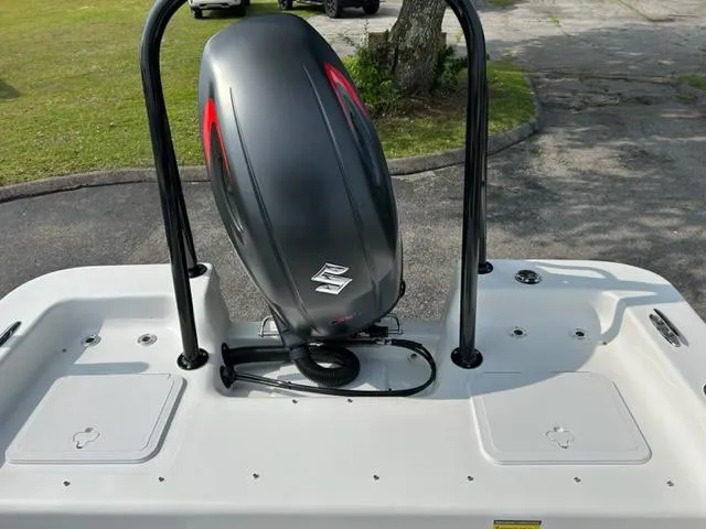 Slide: The Image of 2024 Savannah SS21 boat with Suzuki outboard motor, rear deck view. - 23
