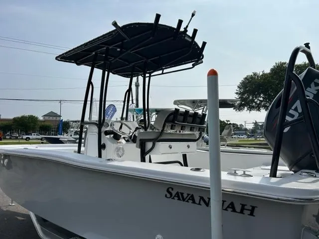 Slide: The Image of 2024 Savannah SS21 boat with T-top and Suzuki outboard motor. - 7