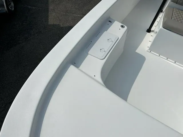 Slide: The Image of 2024 Savannah SS21 boat interior, white deck with storage compartment. - 18