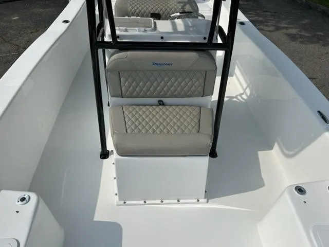 Slide: The Image of 2024 Savannah SS21 boat interior with cushioned seating and center console. - 19