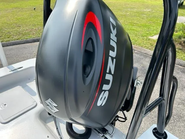 Slide: The Image of 2024 Savannah SS21 boat with Suzuki outboard motor. - 24