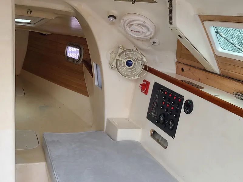 Slide: The Image of Interior of 2016 Farrier F-25C #22 sailboat with control panel and seating area. - 10