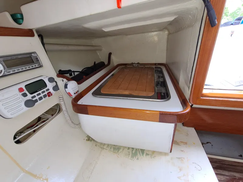 Slide: The Image of Compact kitchen area in a 2016 Farrier F-25C #22 sailboat with stove and control panel. - 12