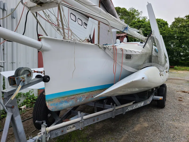 Slide: The Image of Farrier F-25C #22 sailboat on trailer, 2016 model, docked outdoors. - 2