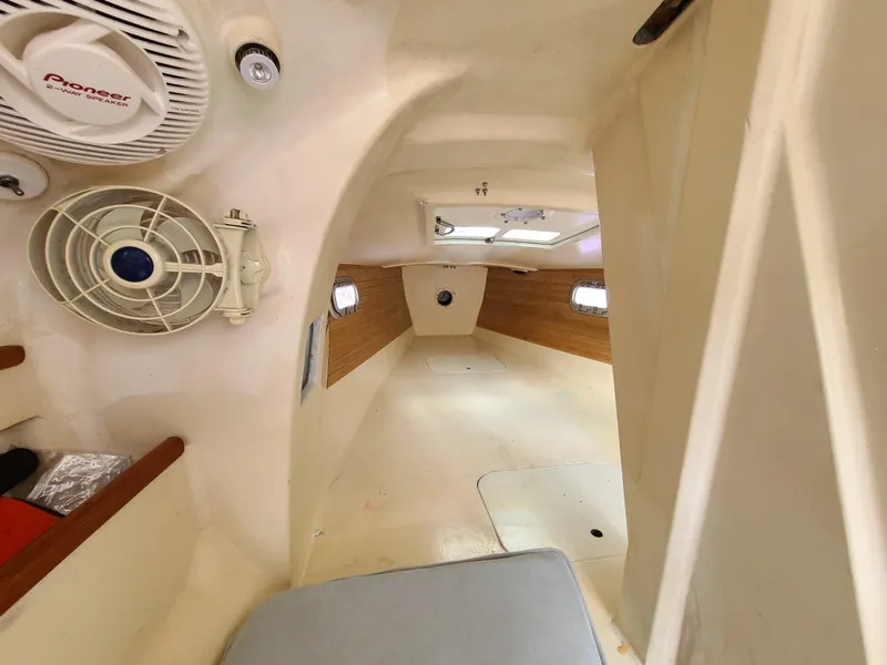 Slide: The Image of Interior of 2016 Farrier F-25C #22 sailboat cabin with fan and wooden accents. - 5