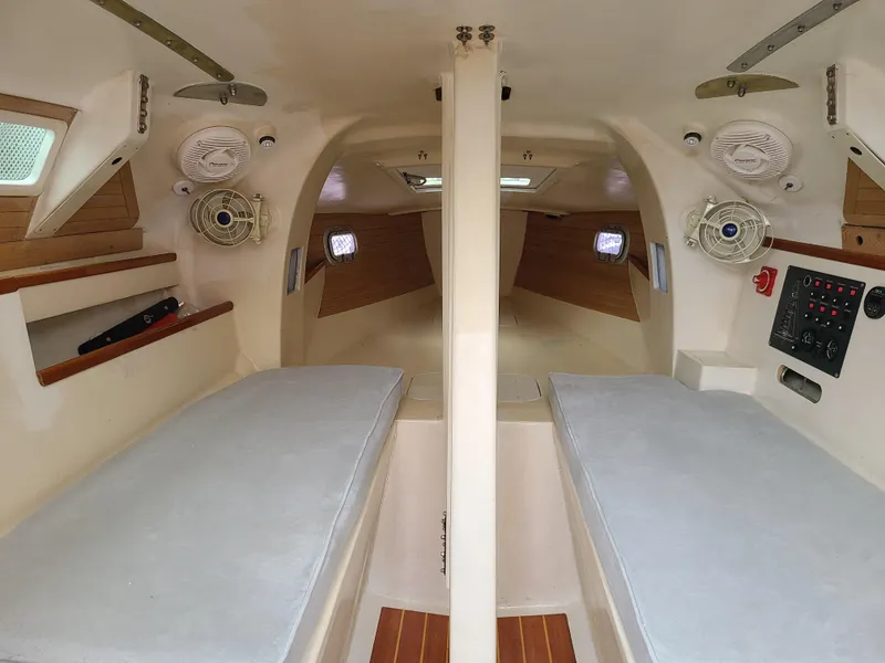 Slide: The Image of Interior of 2016 Farrier F-25C #22 sailboat with twin berths and control panel. - 8