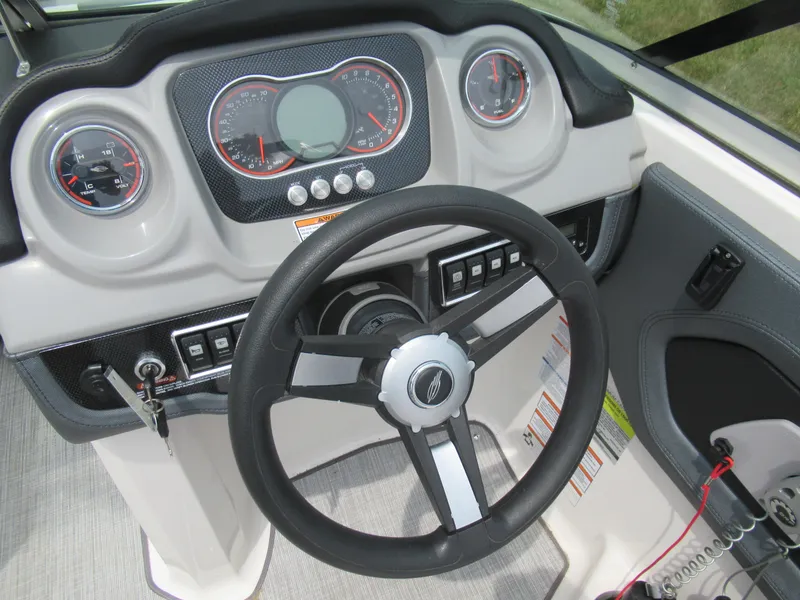 Slide: The Image of 2020 Vortex 203 VR boat dashboard with steering wheel and instrument panel. - 13