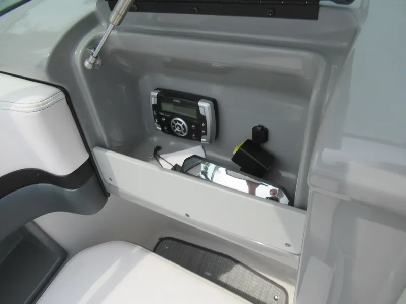 Slide: The Image of 2020 Vortex 203 VR boat dashboard with stereo system and storage compartment. - 15