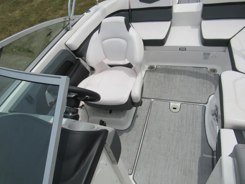 Slide: The Image of 2020 Vortex 203 VR boat interior with white captain's chair and seating area. - 21