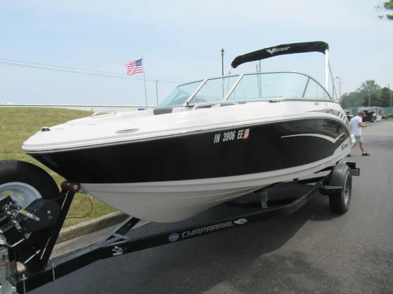 Slide: The Image of 2020 Vortex 203 VR boat on trailer, black and white, with American flag in background. - 5