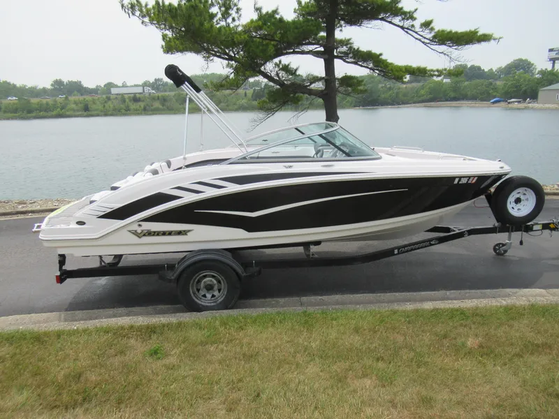 Slide: The Image of 2020 Vortex 203 VR boat on trailer by a lake. - 9