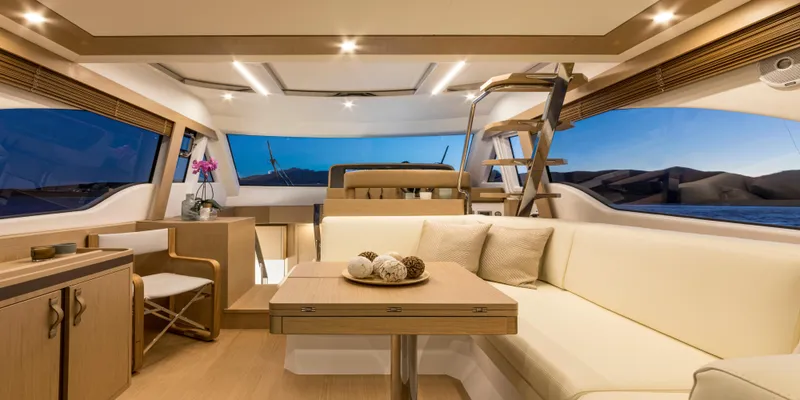 Slide: The Image of Luxurious interior of 2024 Solaris 57 Lobster yacht with elegant seating and panoramic windows. - 8