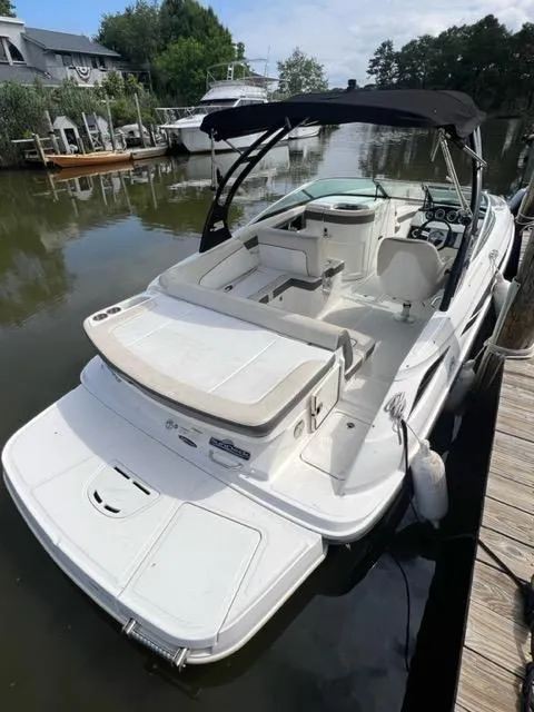 The Image of 2013 Sea Ray 240 Sundeck boat docked in a marina. - 0