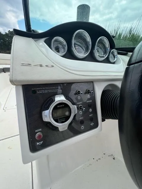 Slide: The Image of Control panel of a 2013 Sea Ray 240 Sundeck boat. - 20