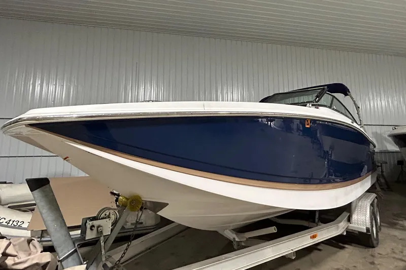 The Image of 2008 Four Winns 262 boat on trailer in storage facility. - 0