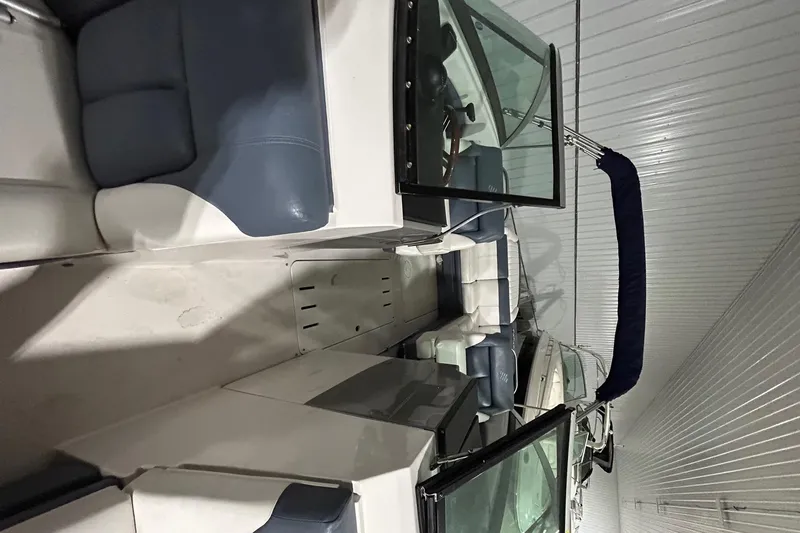 Slide: The Image of 2008 Four Winns 262 boat interior with blue and white seating. - 12