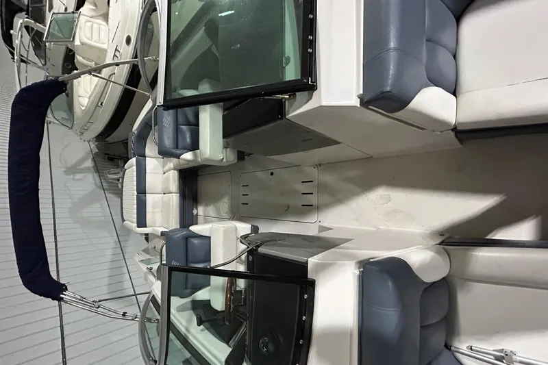 Slide: The Image of 2008 Four Winns 262 boat interior with blue and white seating. - 4