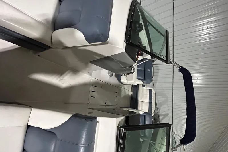 Slide: The Image of 2008 Four Winns 262 boat interior with blue and white seating. - 5