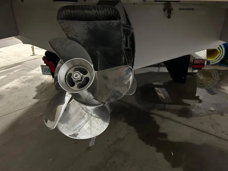 Slide: The Image of Close-up of a 2008 Four Winns 262 boat propeller in a garage. - 2