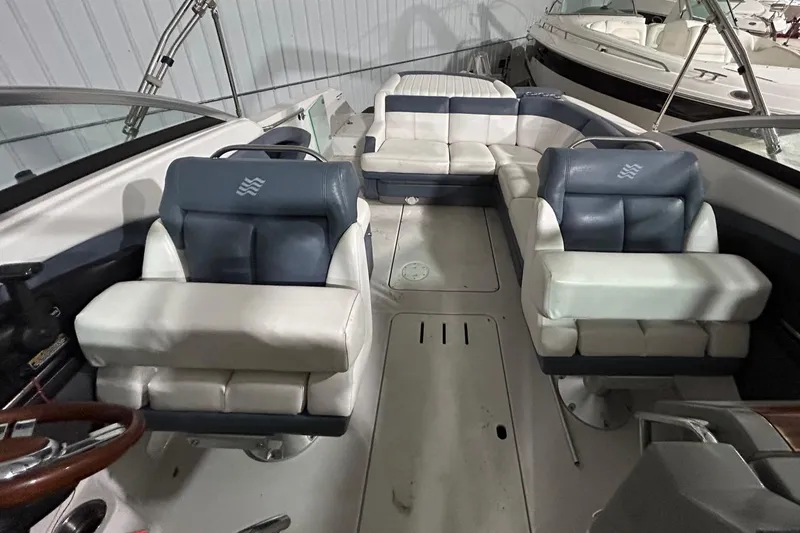 Slide: The Image of 2008 Four Winns 262 boat interior with white and blue seating. - 7