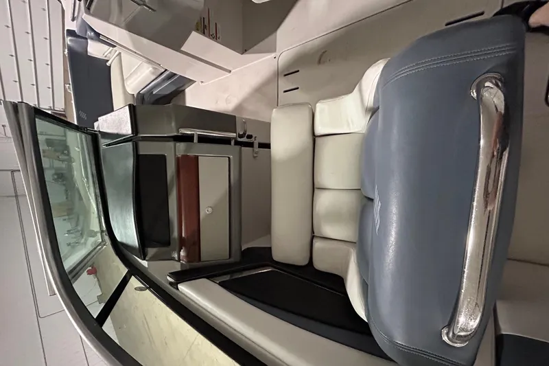 Slide: The Image of 2008 Four Winns 262 boat interior with blue and white seating. - 9