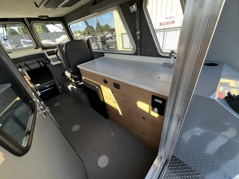 Slide: The Image of Interior of 2023 Thunder Jet 26 Pilot boat with modern amenities and spacious design. - 14