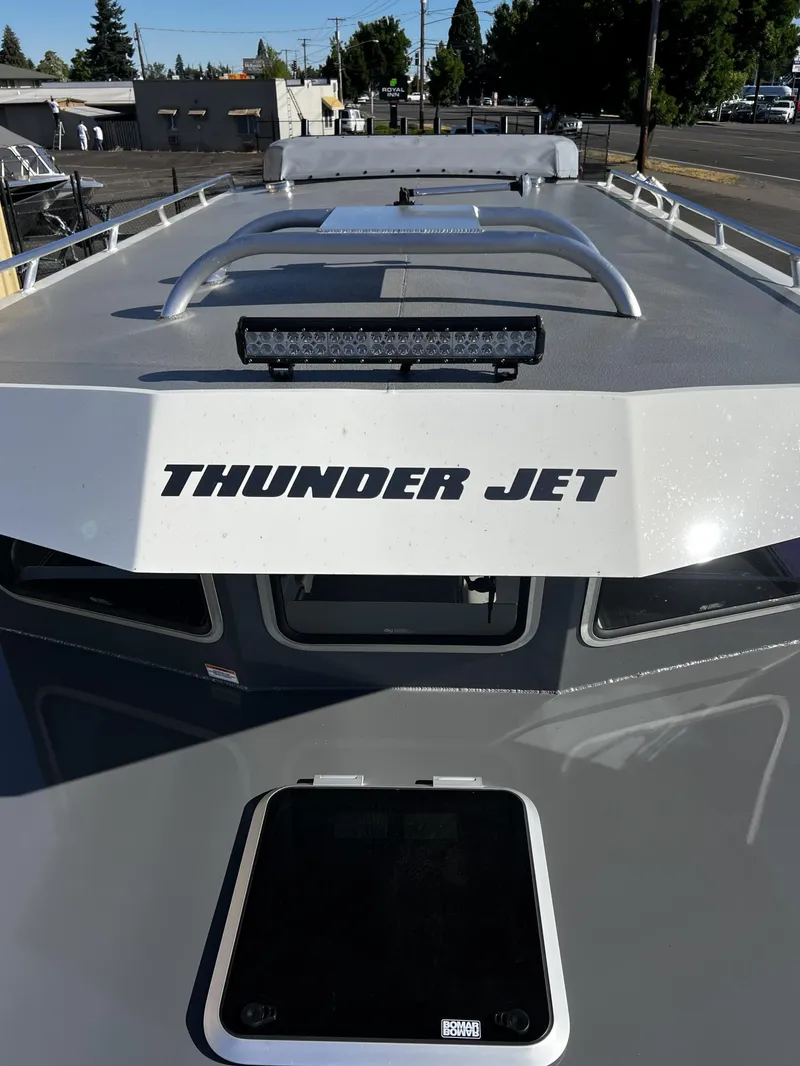 Slide: The Image of 2023 Thunder Jet 26 Pilot boat, rear view with logo and deck details. - 2