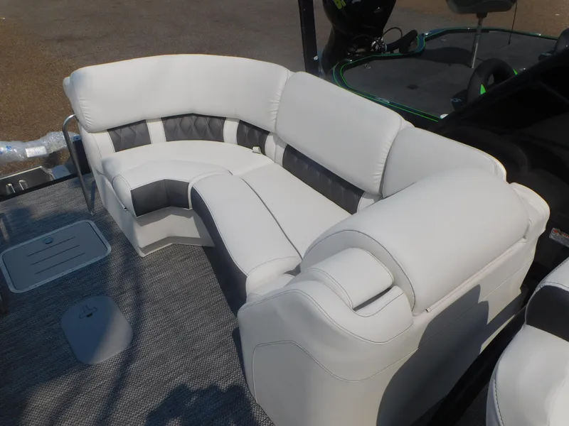 Slide: The Image of 2024 Bennington 23 RFBA boat with luxurious white and gray seating. - 10