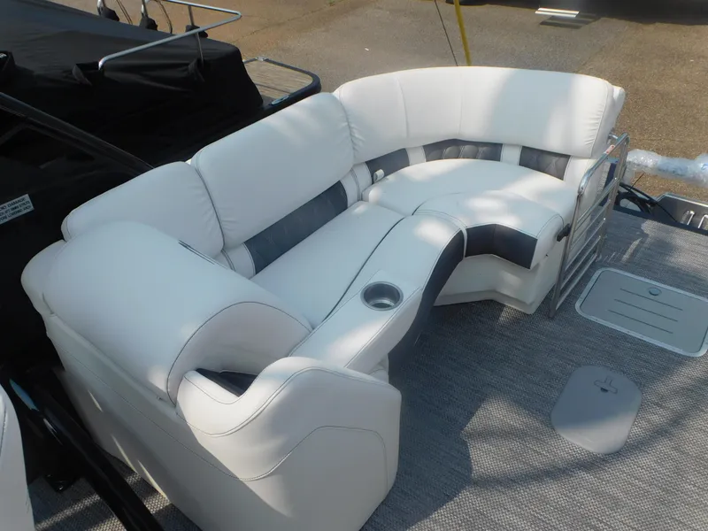 Slide: The Image of 2024 Bennington 23 RFBA boat with luxurious white seating and cup holder. - 11