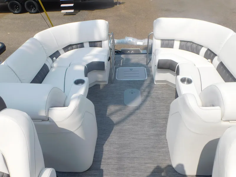 Slide: The Image of 2024 Bennington 23 RFBA pontoon boat with spacious seating and cup holders. - 12