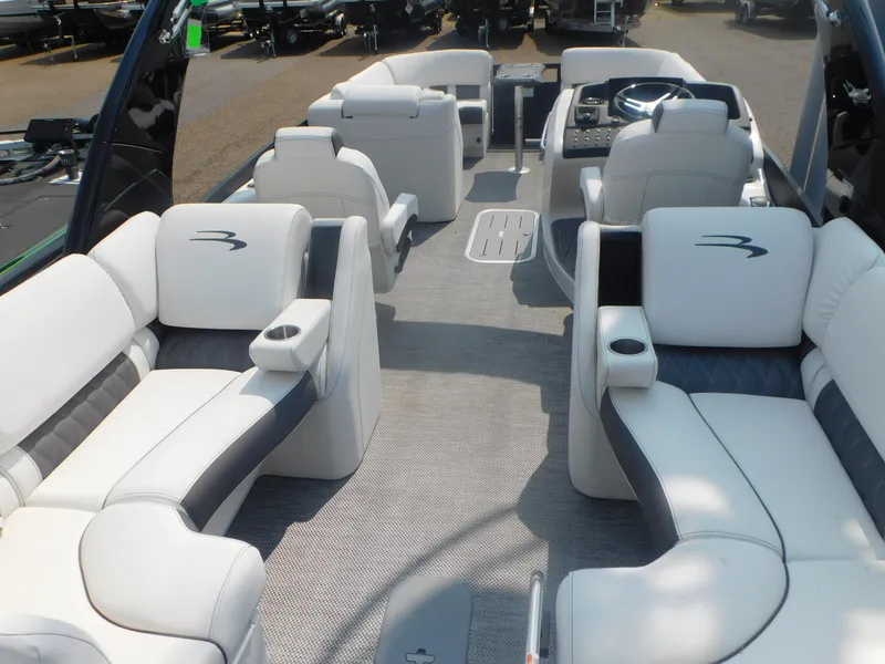 Slide: The Image of 2024 Bennington 23 RFBA pontoon boat interior with luxurious white seating. - 13