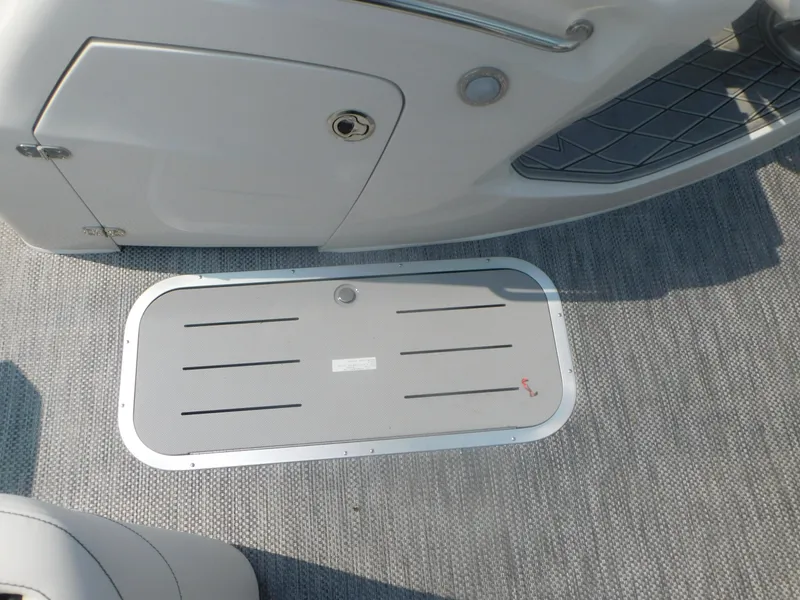 Slide: The Image of 2024 Bennington 23 RFBA boat deck with storage compartment. - 4