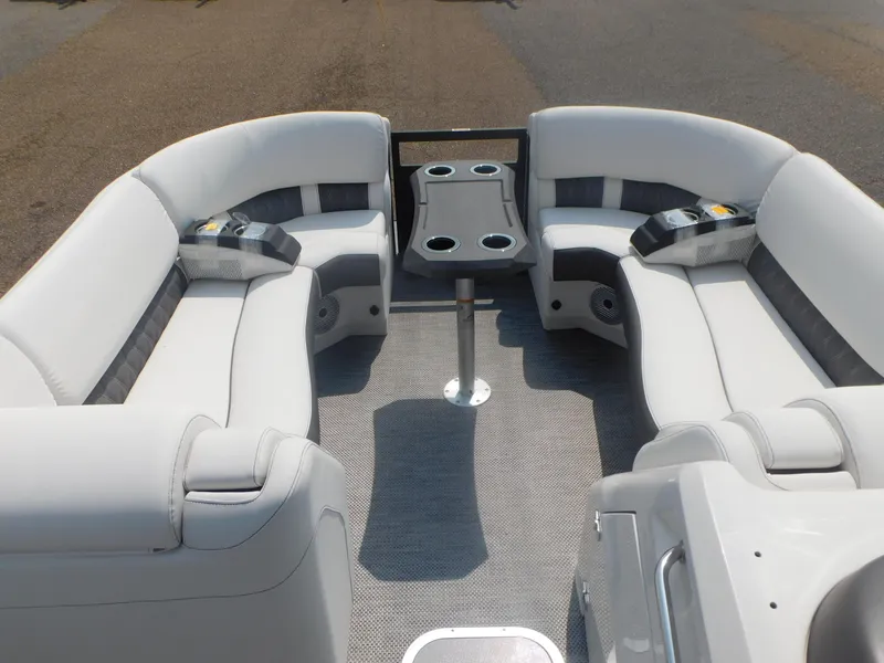 Slide: The Image of 2024 Bennington 23 RFBA boat interior with plush seating and cup holders. - 7