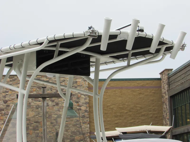 Slide: The Image of 2023 Mako 214 CC boat with rod holders and T-top. - 15