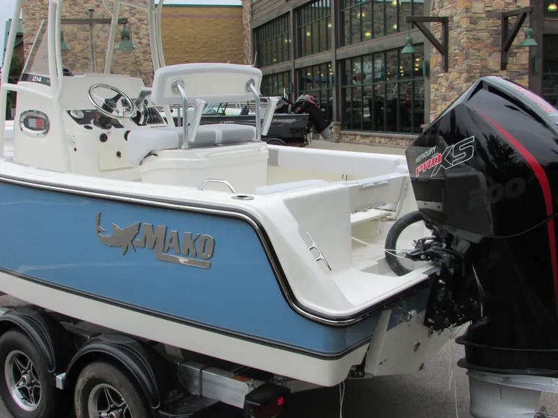 Slide: The Image of 2023 Mako 214 CC boat with Mercury Pro XS engine on trailer. - 6