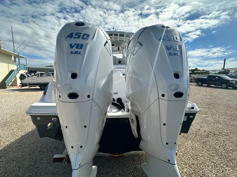 Slide: The Image of 2024 Sea Fox 328 Commander with twin 450 V8 engines, rear view. - 14