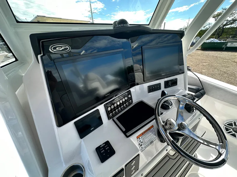 Slide: The Image of 2024 Sea Fox 328 Commander helm with dual displays and modern controls. - 17